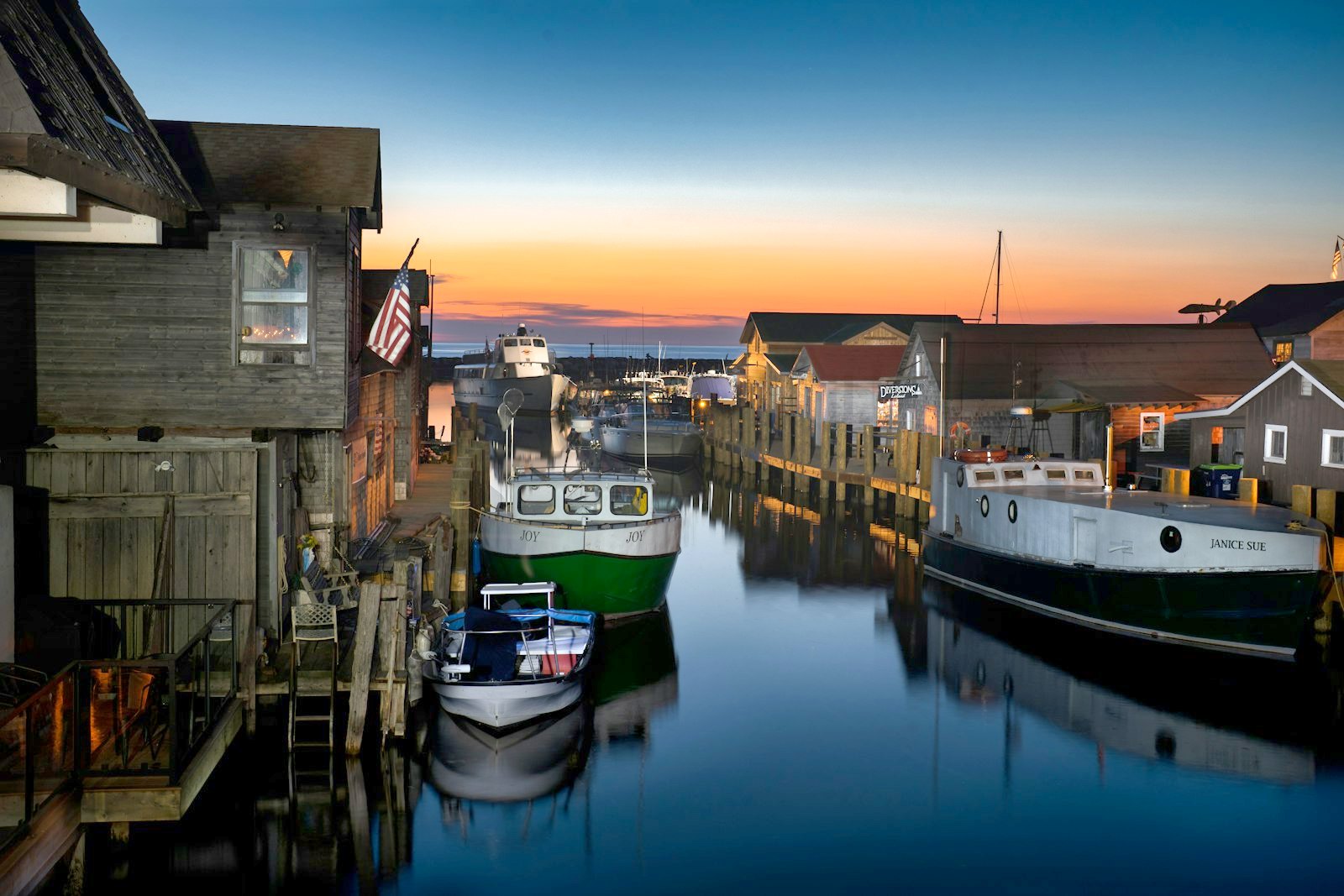 Alder Bay harbour at dusk, boats at the pier